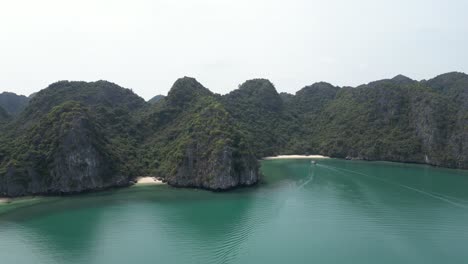 bright-blue-water-and-steep-cliffs-with-private-beaches-in-Cat-Ba-and-Halong-Bay-in-Northern-Vietnam