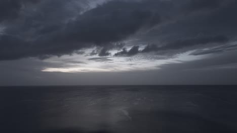 Timelapse-of-clouds-above-ocean-in-sunset-in-Caribbean