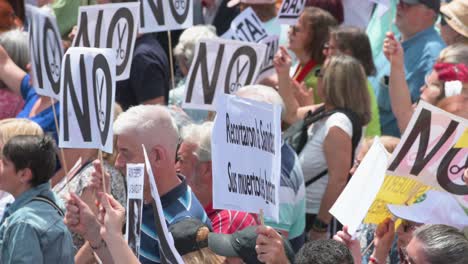 Protesters-hold-placards-during-a-march-to-defend-public-healthcare