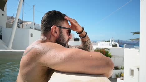 a-hot-guy-in-slow-motion-on-the-edge-of-the-pool