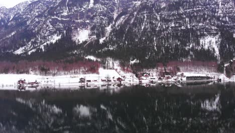 Incredible-reflection-of-the-mountains-on-lake-Fuschl-in-Austria,-aerial-shot-HD