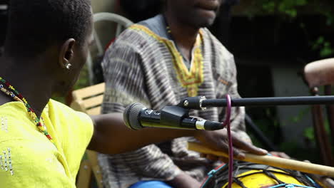 Three-Gambian-drummers-play-at-a-small,-daytime-event