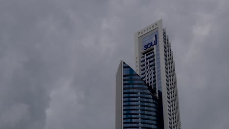 Timelapse-of-singular-Gold-Coast-buildings-with-fast-moving-clouds