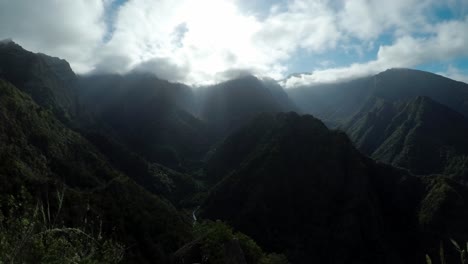 The-beautiful-mountain-landscape-of-Madeira,-Portugal-with-the-sun-peeking-through-the-clouds---Time-lapse