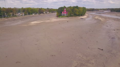 Aerial-push-in-toward-lighthouse-at-drained-Wixom-Lake-after-flood