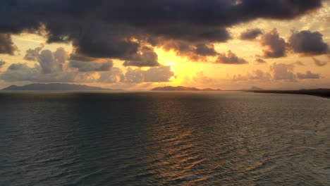 Drone-Hyperlapse-of-sunrise-over-tropical-beach---Townsville,-North-Queensland,-Australia