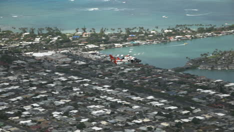 Coast-guard-rescue-helicopter-ascending-on-an-emergency-mission-Honolulu,-Oahu,-Hawaii