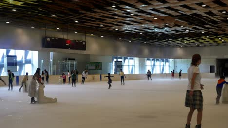 Filipino-families-enjoying-the-ice-skating-facilities-within-the-SM-Seaside-Mall-on-South-Road-Properties,-Cebu-City,-Philippines