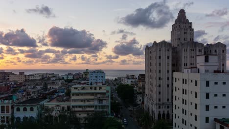 Aerial-Beautiful-Time-lapse-view-of-the-residential-neighborhood-in-the-Old-Havana-City,-Capital-of-Cuba,-during-a-colorful-and-cloudy-sunset