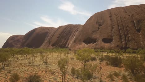 Uluru-Ayres-Rock,-dramatic-view-flying-towards-the-iconic-Australian-landmark