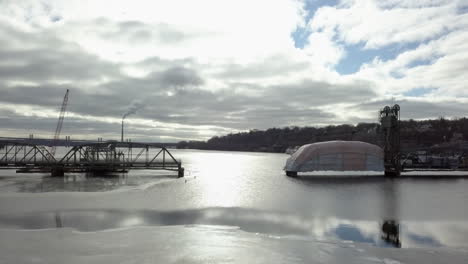 Flying-towards-Stillwater-Lift-Bridge,-Minnesota-with-ice-on-the-river