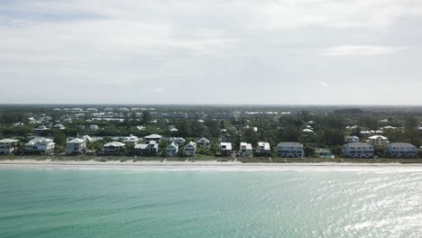 High-to-low-heli-boom-showing-Palm-Island-beach-to-dropping-down-to-Ocean-level