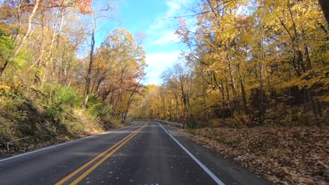 Driving-car-in-beautiful-autumn-foliage,-Leaf-peeping-concept,-Momijigari-concept