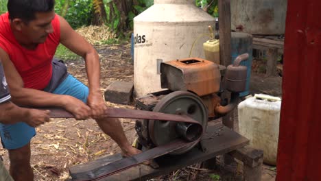 Peruvian-men-working-on-a-manual-artisanal-rum-distillery