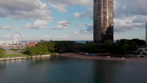 Aerial-drone-footage-in-and-around-Chicago's-Navy-Pier,-showing-beautiful-water,-yachts,-and-the-Chicago-skyline