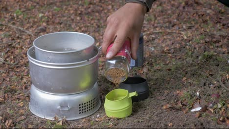 Preparing-two-cups-of-coffee-in-the-forest,-Static-shot