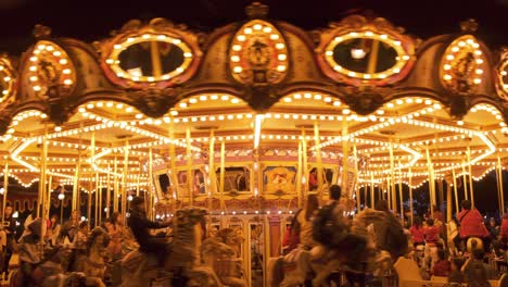 People-enjoy-themselves-on-a-carousel-at-night