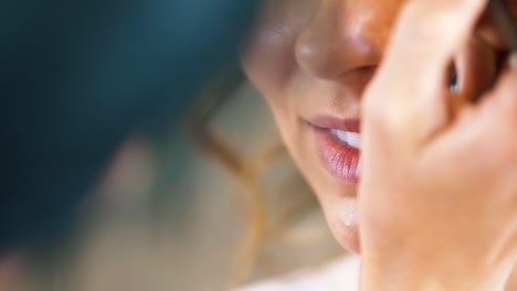 Bride-having-makeup-down-on-wedding-day-before-service