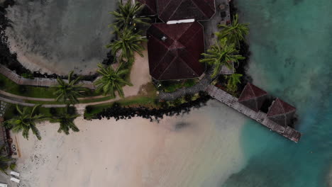 Aerial-view-above-a-resort-and-it's-pristine-water-on-the-coast-of-Samoa