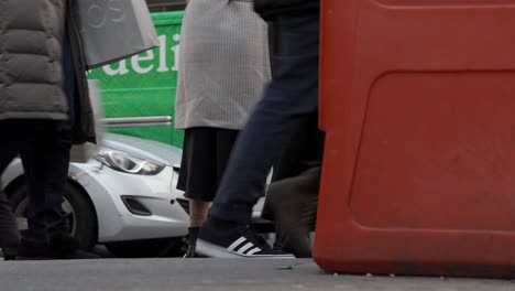 People-walk-on-the-street,-close-up-shot-to-foot,-shoes,-boots,-sneakers