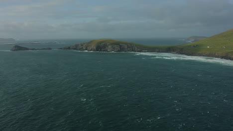 Aerial-view-of-Dunmore-Head,-it-is-a-promontory-in-the-westernmost-part-of-the-Dingle-Peninsula,-located-in-the-barony-of-Corca-Dhuibhne-in-southwest-County-Kerry,-Ireland