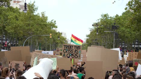 Climate-change-activism-crowd-gathered-holding-fake-polar-bear---banners-in-environmental-demonstration