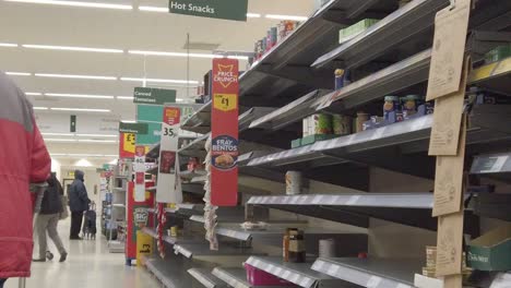 Corona-virus-panic-buying-slow-motion-shopping-supermarket-empty-shelves-canned-goods-aisle