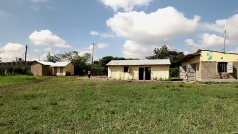 A-teacher-walks-between-buildings-of-a-private-school-in-Nairobi,-Kenya