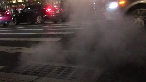 Smoke-coming-up-from-the-streets-of-new-york-by-zebra-crossing