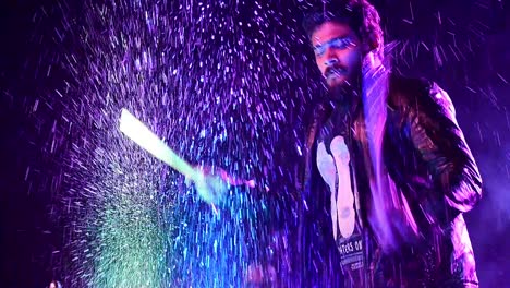 Drummer-playing-drums-after-putting-water-on-them-during-an-architectural-college-fest-in-Kerala