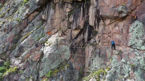 Drone-shots-of-climbers-at-the-Urubamba-cliffs-in-Cusco,-Peru