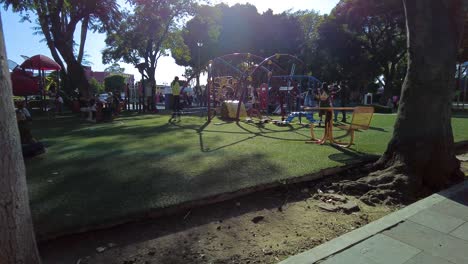 People-gathering-and-having-fun-in-the-park-at-the-downtown-city-square-wearing-masks-during-the-pandemic