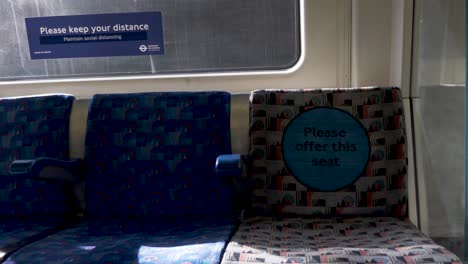 Row-Of-Empty-Seats-On-The-Jubilee-Line-Train-On-Sunny-Day