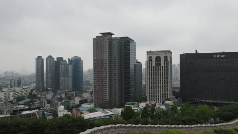 Aerial-shot-flying-close-up-to-skyscrapers-and-towers-in-Seoul-city,-South-Korea