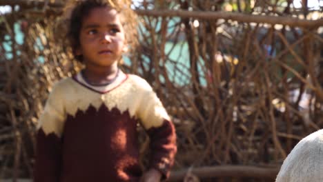 Portrait-of-crying-baby-in-Noondpura-rural-village,-Rajasthan