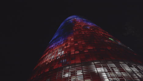 Multicolored-illuminated-lights-on-Torre-Agbar-skyscraper-Spain