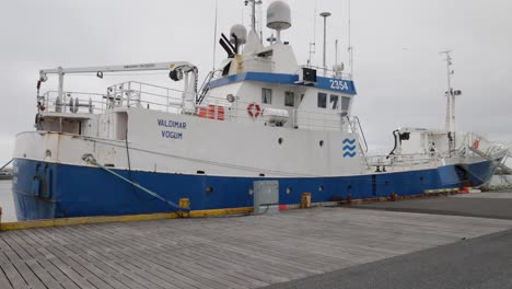 Ship-in-port-located-in-Grindavik,-Iceland-with-gimbal-video-walking-forward