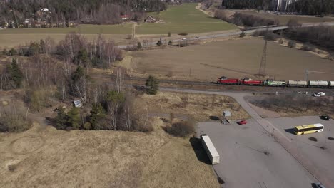 Aerial-side-view-of-3-VR-diesel-locomotives-pulling-a-long-line-of-oil-transport-carriages