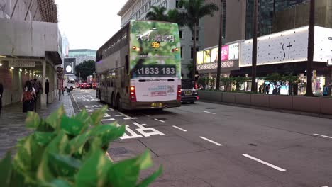 Double-Decker-Bus-Arrives-at-the-Bus-Stop-in-Tsim-Sha-Tsui,-Hong-Kong