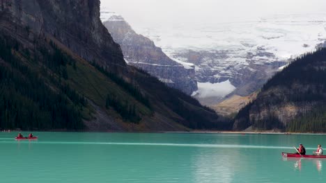 Leisurely-canoeing-right-to-left-on-Lake-Louise,-Banff,-Alberta,-Canada