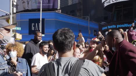 A-crowd-of-Biden-Harris-supporters-jump-and-cheer-to-celebrate-the-results-of-the-2020-Presidential-Election-in-the-United-States