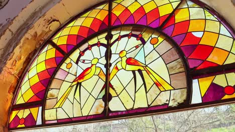 Antique-stained-glass-in-obsolete-wall-inside-Yerevan-Children-Railway,-Armenia