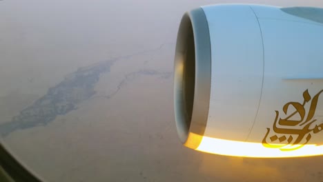 Emirates-aircraft-flying-mid-air-over-earth