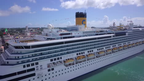 Aerial-view-of-the-side-of-Costa-Pacifica-cruise-ship-docked-in-the-port-of-Pointe-à-Pitre,-Guadeloupe