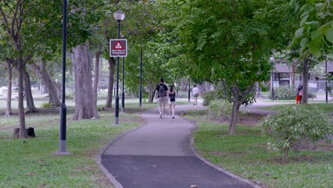 Tourist-Couple-Strolling-On-Changi-Beach-Park-During-Summer-In-Singapore