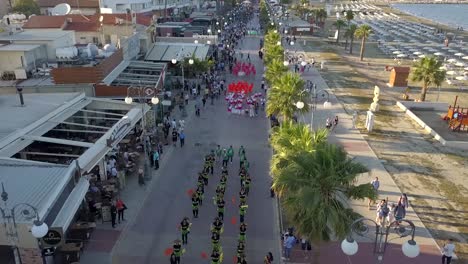 Aerial-Shot-Of-People-wearing-Colorful-Costumes-Walking-In-Parade