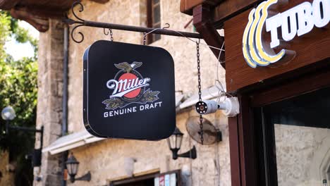 Hanging-Miller-Genuine-Draft-Signboard-Outside-Bar-In-Nicosia,-North-Cyprus