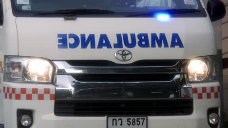 Ambulances-turn-on-emergency-lights-while-transporting-patients-infected-with-Corona-2019-during-the-global-Covid-19-epidemic-situation-in-Nonthaburi,-Thailand