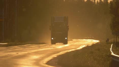 truck-transporting-timber-on-Swedish-road-during-midnight