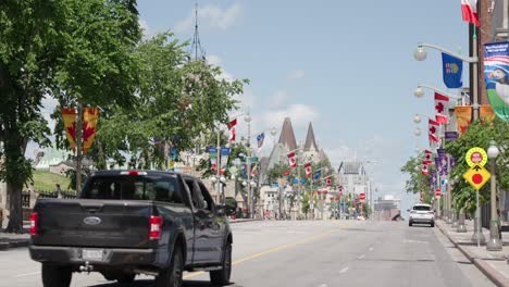 Black-pickup-truck-on-Wellington-Street-on-a-sunny-summer-day-before-Canada-Day-2022---4K-slow-motion